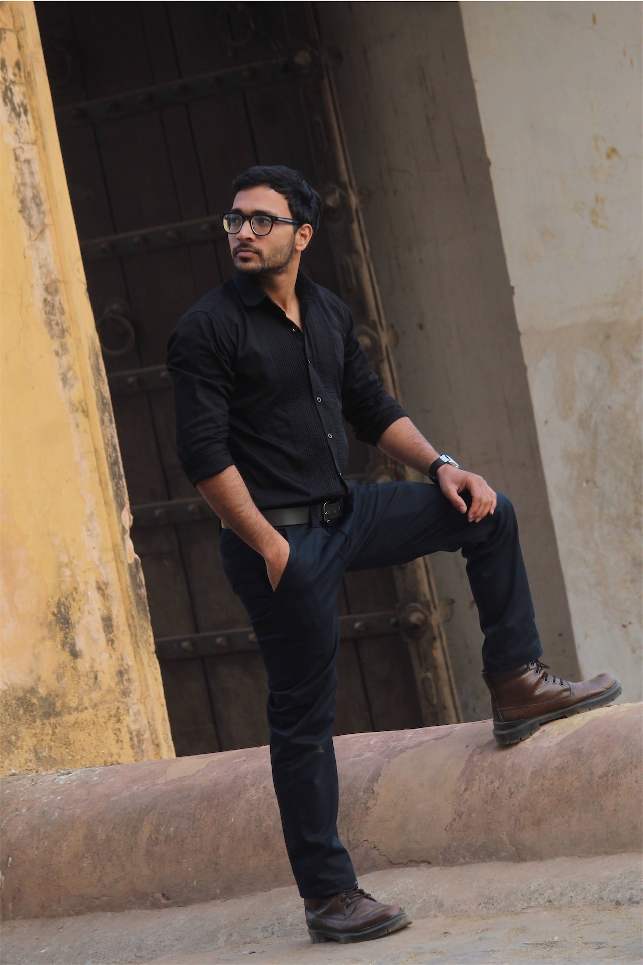 Man posing at historic building