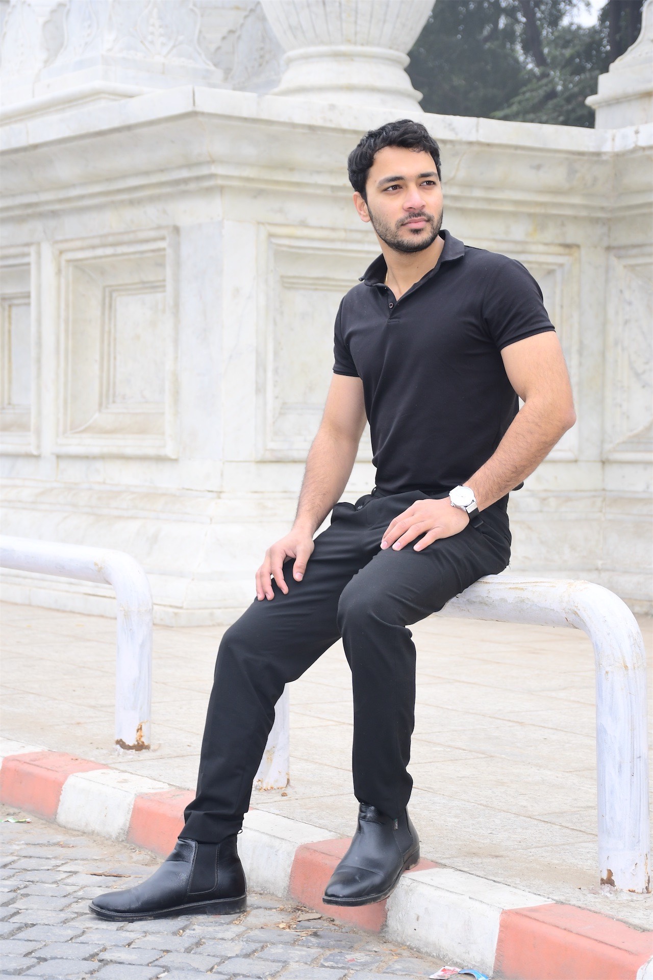 Man sitting in street style