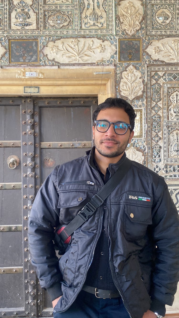 Man standing at historic door